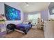 Cozy bedroom with vaulted ceilings, carpet, and large window providing natural light at 1492 Bourdon Bell Se Dr, Conyers, GA 30013