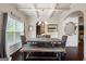 Elegant dining room with coffered ceilings, dark hardwood floors, and a large window at 1492 Bourdon Bell Se Dr, Conyers, GA 30013