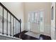 Bright foyer showcases dark hardwood floors, wainscoting, and a white front door with sidelights at 1492 Bourdon Bell Se Dr, Conyers, GA 30013