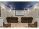 Basement home theater with screen, seating, and recessed lighting for entertainment at 1492 Bourdon Bell Se Dr, Conyers, GA 30013