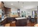Modern kitchen featuring stainless steel appliances, granite countertops, dark wood cabinetry, and an island at 1492 Bourdon Bell Se Dr, Conyers, GA 30013