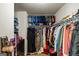 Spacious walk-in closet with ample storage featuring shelving and hanging racks for organization at 1492 Bourdon Bell Se Dr, Conyers, GA 30013