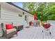 Inviting back deck with outdoor seating, grill, and 'Home Sweet Home' decor at 394 Thornbrooke Dr, Hiram, GA 30141