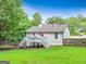 A sprawling backyard with lush green grass and a deck off the back of the house at 394 Thornbrooke Dr, Hiram, GA 30141
