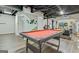 Finished basement featuring a pool table, painted walls, and exposed ceiling rafters at 394 Thornbrooke Dr, Hiram, GA 30141