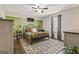 Cozy bedroom showcasing a black iron bed frame, stylish rug, and decorative green accent wall at 394 Thornbrooke Dr, Hiram, GA 30141