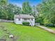 Charming, well-maintained home with a lovely front yard, inviting curb appeal, and a delightful covered porch at 394 Thornbrooke Dr, Hiram, GA 30141