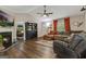 Inviting living room featuring a fireplace, plush seating, and a seamless transition to the adjacent bedroom at 394 Thornbrooke Dr, Hiram, GA 30141