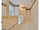 This bathroom offers a soaking tub, shower, and a decorative wallpaper at 4135 Coursey Lake Rd, Douglasville, GA 30135
