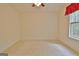 Spacious carpeted bedroom showcasing natural light and ceiling fan at 4135 Coursey Lake Rd, Douglasville, GA 30135