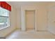Bright bedroom with a view to the outside from the window, and a built-in closet at 4135 Coursey Lake Rd, Douglasville, GA 30135