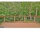 Large wooden deck with a beautiful view of the wooded area; perfect for outdoor entertaining at 4135 Coursey Lake Rd, Douglasville, GA 30135