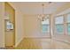 Bright dining room with hardwood floors, chandelier, and plenty of natural light from large windows at 4135 Coursey Lake Rd, Douglasville, GA 30135