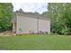 Side yard features grass, and home utilities near the back of the house at 4135 Coursey Lake Rd, Douglasville, GA 30135