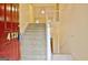 Welcoming two-story foyer with staircase and open railing leading to the upper level at 4135 Coursey Lake Rd, Douglasville, GA 30135