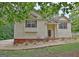 Inviting home with well-manicured lawn, walkway, and cozy front porch entrance at 4135 Coursey Lake Rd, Douglasville, GA 30135