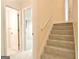 Hallway with carpeted stairs to a bedroom with open door, offering an inviting space at 4135 Coursey Lake Rd, Douglasville, GA 30135