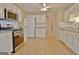 Spacious kitchen with stainless appliances, white cabinets, and lots of counter space at 4135 Coursey Lake Rd, Douglasville, GA 30135