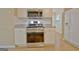 The kitchen features stainless appliances, granite countertops, and white cabinets at 4135 Coursey Lake Rd, Douglasville, GA 30135