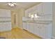 The modern kitchen features white cabinetry and granite countertops at 4135 Coursey Lake Rd, Douglasville, GA 30135