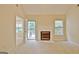 Cozy living room with fireplace and access to a deck through french doors, offering a great view at 4135 Coursey Lake Rd, Douglasville, GA 30135