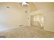 Large carpeted living room boasts high ceilings and an open view to the upper level staircase at 4135 Coursey Lake Rd, Douglasville, GA 30135