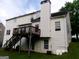 Back of vinyl sided house with a deck and stairs to the yard at 2225 Blue Ridge Ln, Conyers, GA 30012