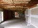 Unfinished basement featuring exposed ceiling and access to the outdoors at 2225 Blue Ridge Ln, Conyers, GA 30012