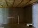 Unfinished basement with concrete walls and ceiling insulation at 2225 Blue Ridge Ln, Conyers, GA 30012