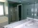 Bathroom with a double sink vanity, walk-in shower, soaking tub, and large mirror at 2225 Blue Ridge Ln, Conyers, GA 30012