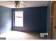 Bedroom featuring a ceiling fan and window with 
