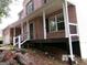 Two story brick house featuring a large covered front porch at 2225 Blue Ridge Ln, Conyers, GA 30012