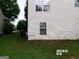 Side view of vinyl sided house featuring manicured lawn at 2225 Blue Ridge Ln, Conyers, GA 30012