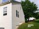 Side view of house featuring vinyl siding and a manicured lawn at 2225 Blue Ridge Ln, Conyers, GA 30012