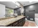Stylish bathroom features a granite countertop, and tiled floors at 537 Country Lake Dr, Mcdonough, GA 30252