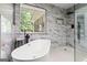Bright bathroom with a free standing tub and sleek fixtures at 537 Country Lake Dr, Mcdonough, GA 30252