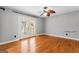 Bright bedroom with hardwood floors, ceiling fan, and access to a deck at 537 Country Lake Dr, Mcdonough, GA 30252