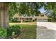 Charming yellow home featuring a lush front yard, covered porch, and an attached two car garage at 537 Country Lake Dr, Mcdonough, GA 30252