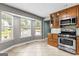 Well-lit kitchen featuring stainless steel appliances, tile floors, and ample cabinet space at 537 Country Lake Dr, Mcdonough, GA 30252
