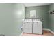 Laundry room with a window, washer and dryer at 537 Country Lake Dr, Mcdonough, GA 30252