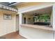 Enjoy this outdoor bar and grill area with granite counters, sink, and screened-in porch with a hot tub at 537 Country Lake Dr, Mcdonough, GA 30252