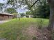 Grassy backyard with shed in the background at 1932 Pharrs Rd, Snellville, GA 30078