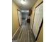 Hallway featuring wood floors, neutral colored walls, and white trim throughout the home at 1932 Pharrs Rd, Snellville, GA 30078