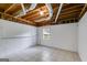 Unfinished basement with exposed ceiling, offering opportunity for customization and expansion at 90 Thomas Overby Dr, Sharpsburg, GA 30277