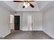 Bedroom featuring a tray ceiling, carpet flooring and neutral paint color, providing a blank canvas at 90 Thomas Overby Dr, Sharpsburg, GA 30277