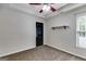 Clean bedroom with carpet floor, natural light and blank walls with a small decorative shelf at 90 Thomas Overby Dr, Sharpsburg, GA 30277
