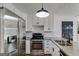 Gourmet kitchen showcasing stainless steel appliances, subway tile backsplash, and modern fixtures at 90 Thomas Overby Dr, Sharpsburg, GA 30277