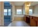 Bathroom featuring a large soaking tub, spacious countertop with double sinks, and neutral tile floors at 275 Autry Mill Ln, Suwanee, GA 30024
