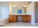 Bright bathroom with a double sink vanity and large mirror provides style and function at 275 Autry Mill Ln, Suwanee, GA 30024