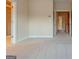Neutral bedroom with carpet flooring, two doorways and base trim molding at 275 Autry Mill Ln, Suwanee, GA 30024
